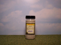 Light tan fine gravel scenic material for dioramas & slot car layouts.