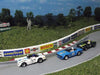 Custom painted AFX slot car bodies.