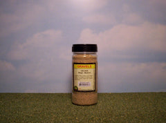 Beige medium gravel scenic material in shaker bottle.
