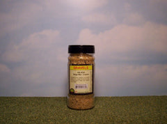 Beige mix coarse gravel scenic material in shaker bottle.